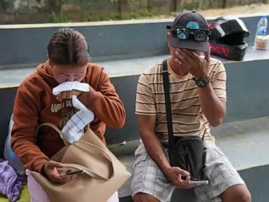 Philippine firefighters enter charred ferry as rescuers search for 84 missing