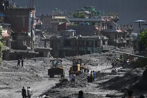 Rescuers dig into tunnel as missing toll from Nepal, China flood tops 3,000