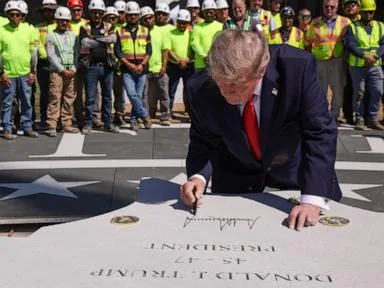 Trump shows off multimillion-dollar White House helipad and adds his signature