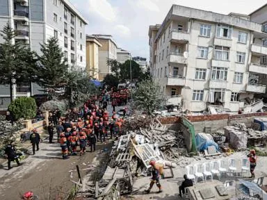 A partial building collapse in Istanbul kills 2 and traps at least 2 more