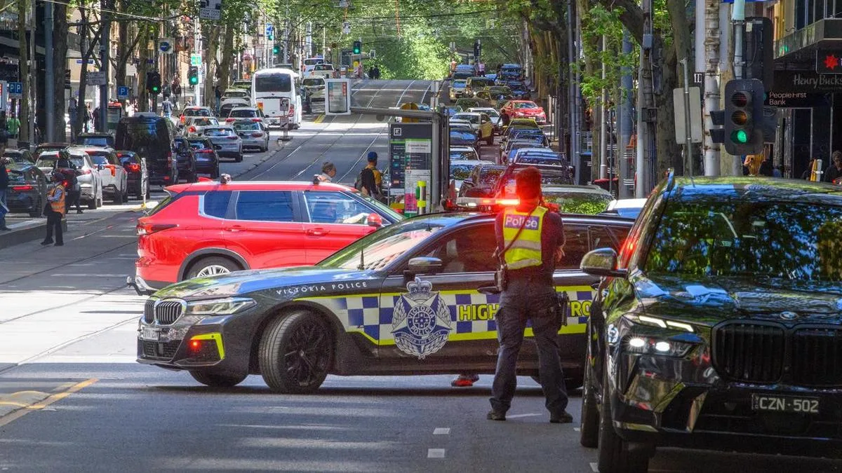 Teen charged after woman struck by car in city centre