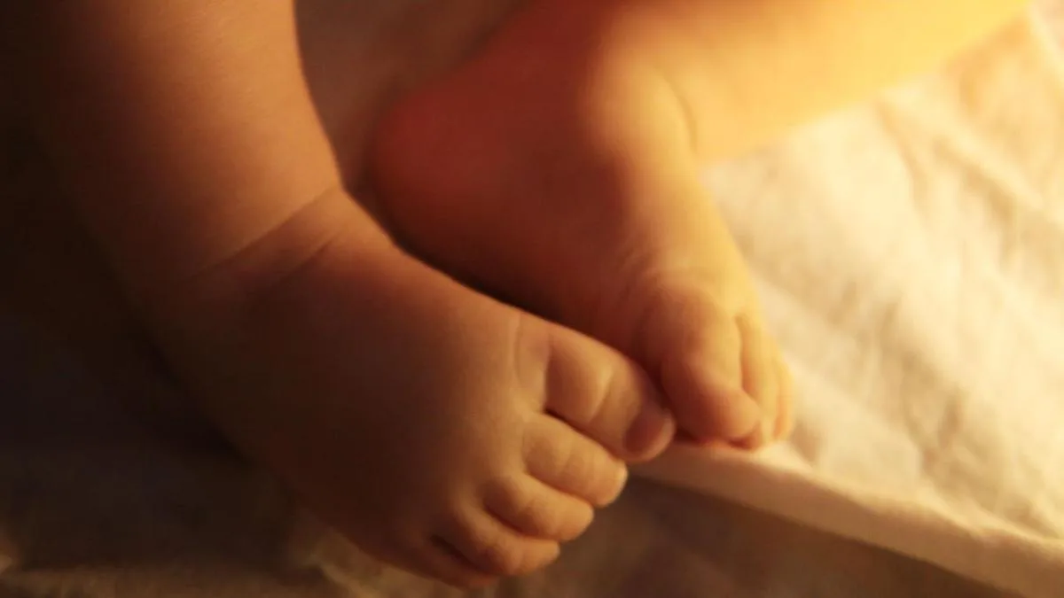 Police officer charged over assault on newborn child
