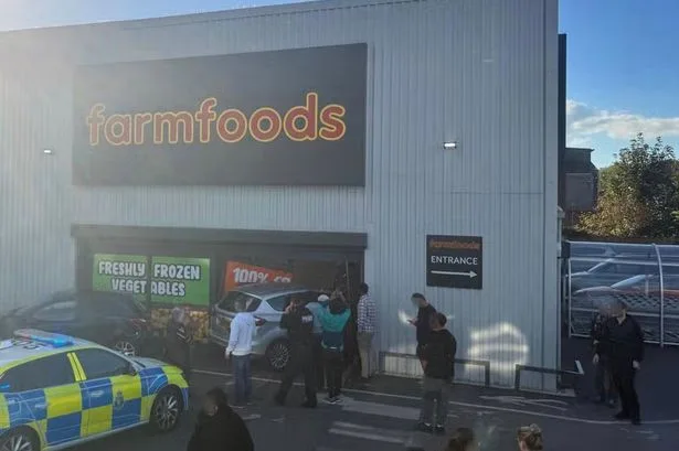 Police swarm Farmfoods after woman 'loses control' and crashes into supermarket