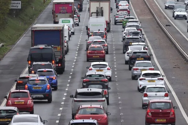 M3 traffic - live: Motorway closed with four-mile queues after huge diesel spill