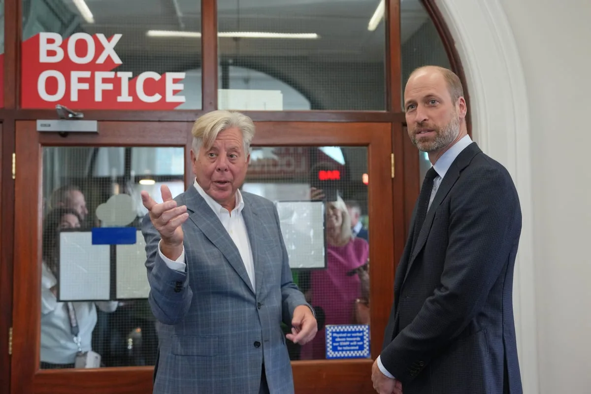 William ignores question about Diana book as he serves popcorn on cinema visit