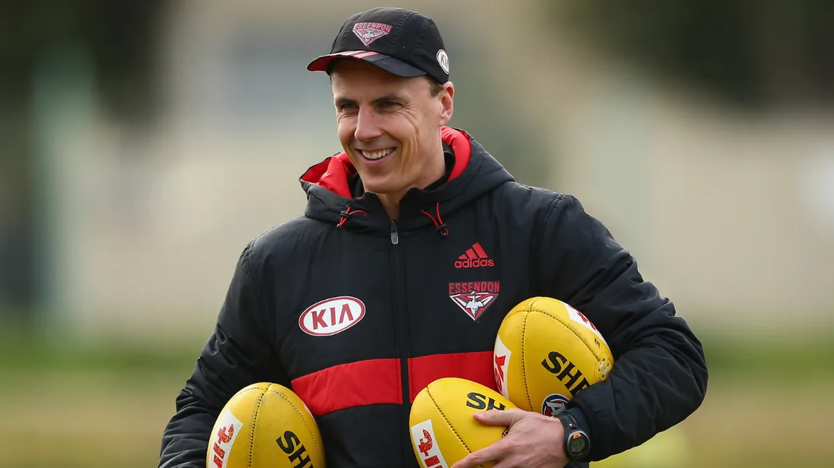 Essendon champion Matthew Lloyd backflips with major coaching admission
