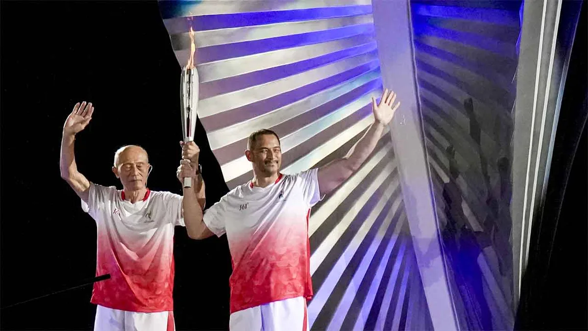 Father-son duo makes history: Shigenobu and Koji light cauldron