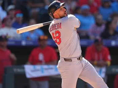 Herrera and Hjerpe lead Cardinals to a 10-8 win over the Rockies