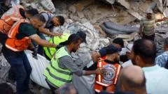 At least 20 killed and dozens missing after war-damaged Gaza building collapses