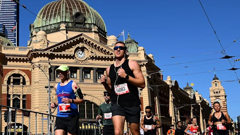 Teen arrested after woman hit by car outside Flinders Street Station near marathon route
