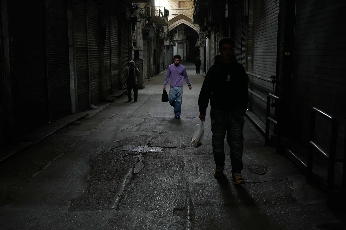 Amid war and sanctions, many Iranians are losing their jobs and struggling to get by