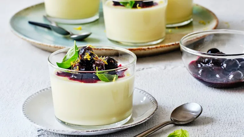 Lemon possets with blueberry spoon fruit