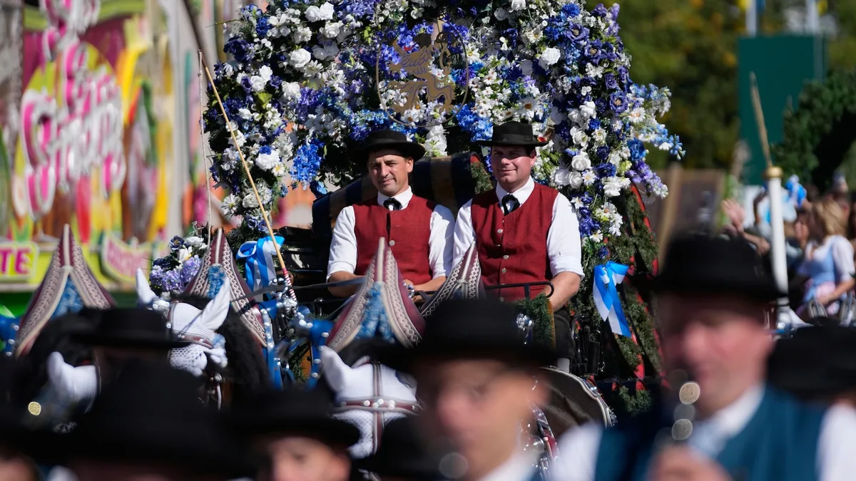 Munich's Oktoberfest roars to life as the mayor taps the first keg