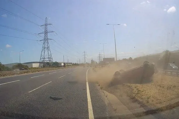Terrifying moment car rolls onto roof after A13 crash