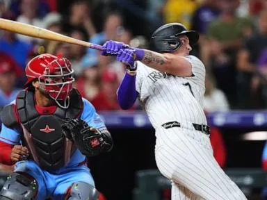 Rockies use 6-run 5th inning to beat Cardinals 10-7