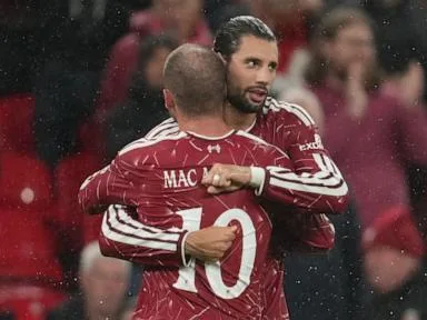 Tottenham's misery continues with loss at Liverpool in English League Cup. Arsenal cruises to win