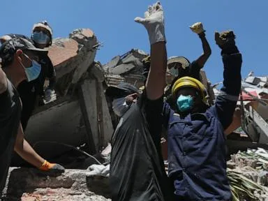 Rescuers call for silence around earthquake rubble as window for survival narrows in Colombia