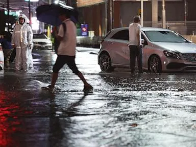 Torrential rain near Tokyo causes flooding and paralyzes traffic, killing 1