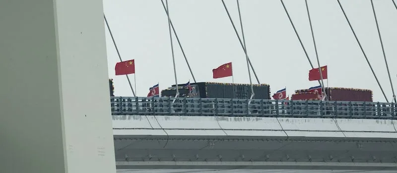 Trucks line up as long-delayed China-North Korea bridge opens