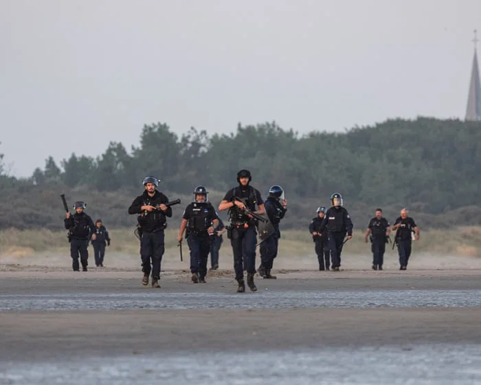 Footage shows clash with French police on beach as dinghy tries to leave for UK