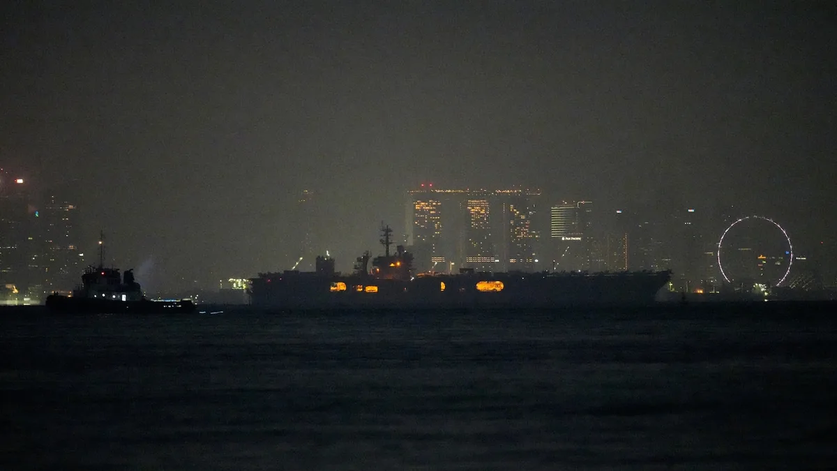 USS Abraham Lincoln sails past Singapore on its way home from Middle East