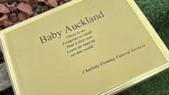 Baby was garroted and hidden under floor - coroner