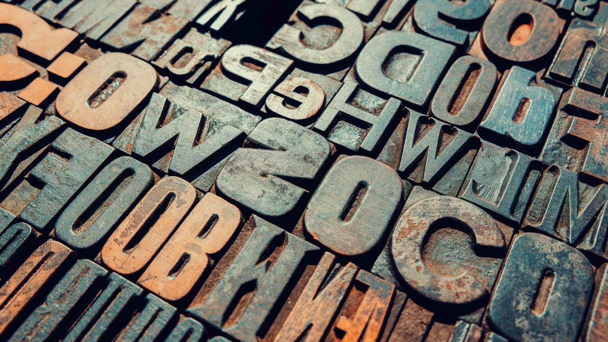 Does written language speed up or slow down cultural change?