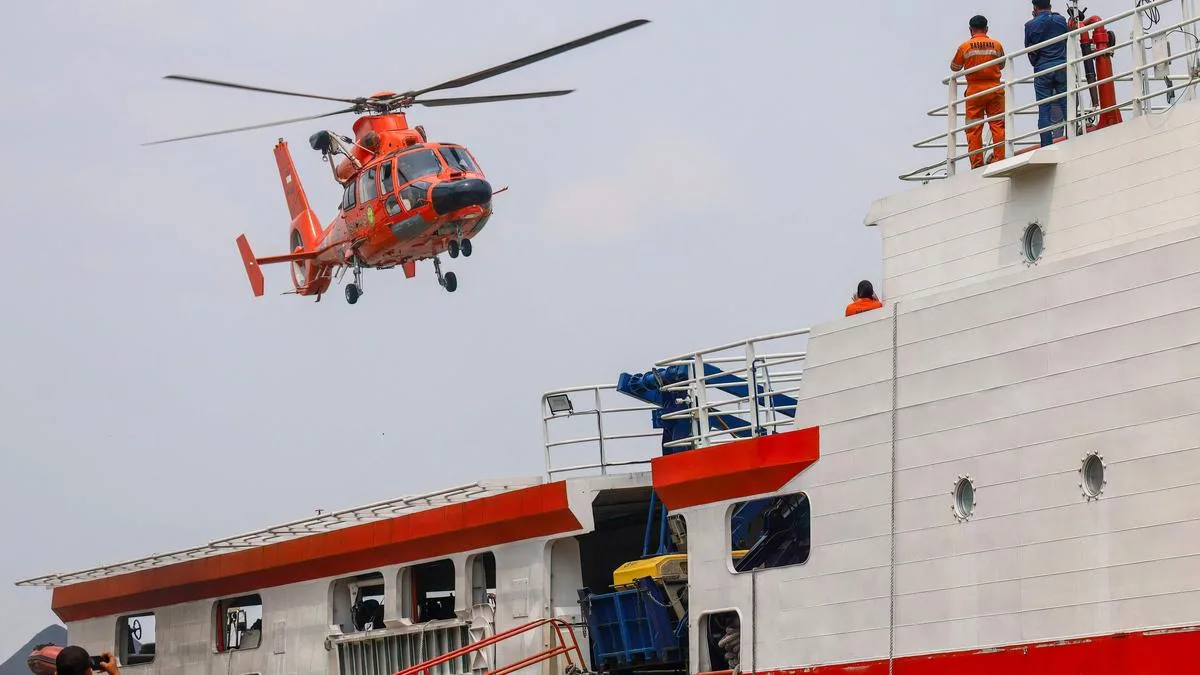 Indonesia begins operation to right capsized ship in Java Sea as 129 remain missing