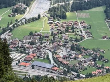 Looming rock collapse threatens Swiss village as thawing permafrost destabilizes Alps