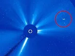 Giant 'UFO mothership' spotted shooting across Earth's sun at 'near light speed', claims UFOlogist
