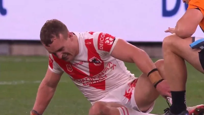 Dragons gun is carried off with a leg injury