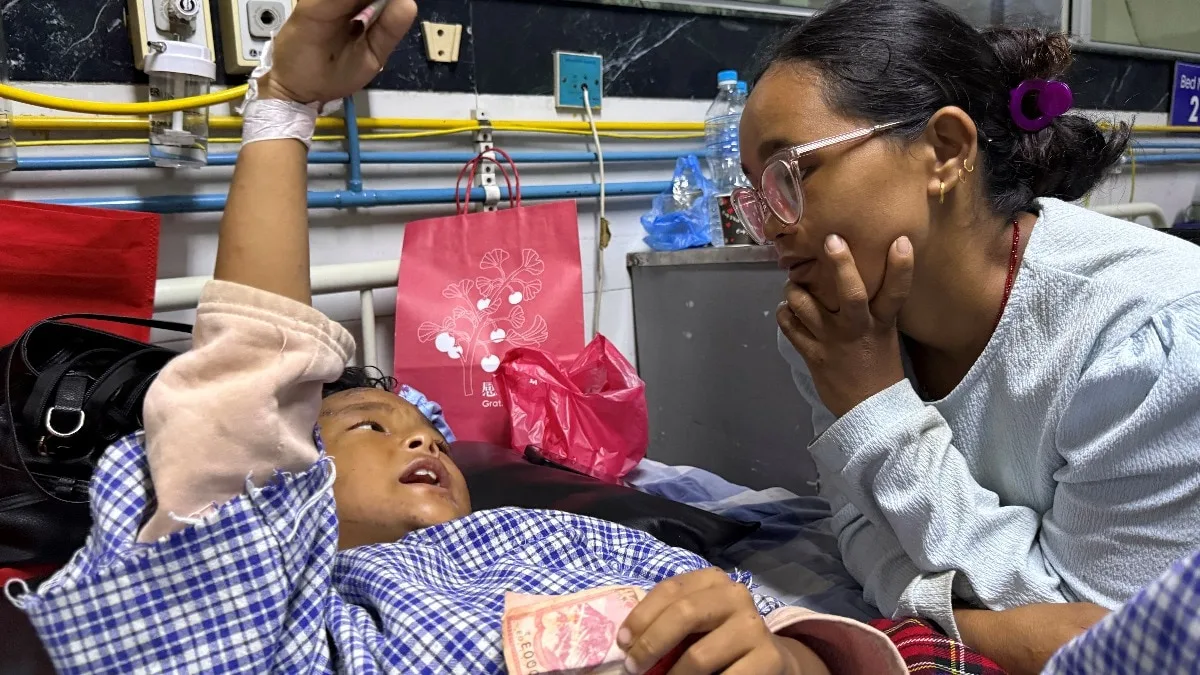 Nepal boy, 8, clung to trees when floods hit, reunited with mother in hospital