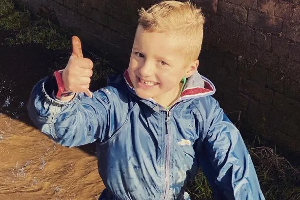 Parents say uplifting funeral helped after son, 7, killed in car crash