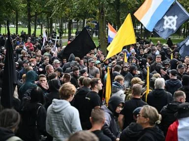 Dutch riot police break up far-right protest in The Hague after violence erupts