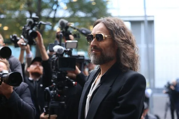 Russell Brand arrives at court for opening of rape and sexual assault trial