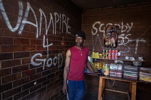 Families live with rubbish and rats in Joburg stadium