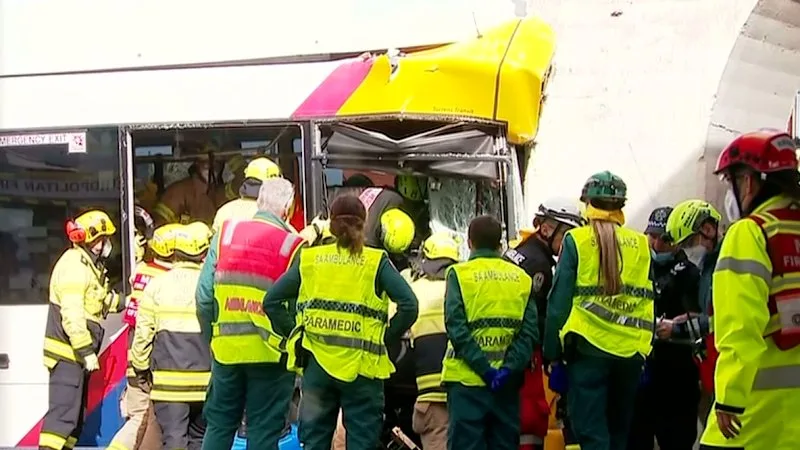 Driver seriously injured after bus slams into rail bridge