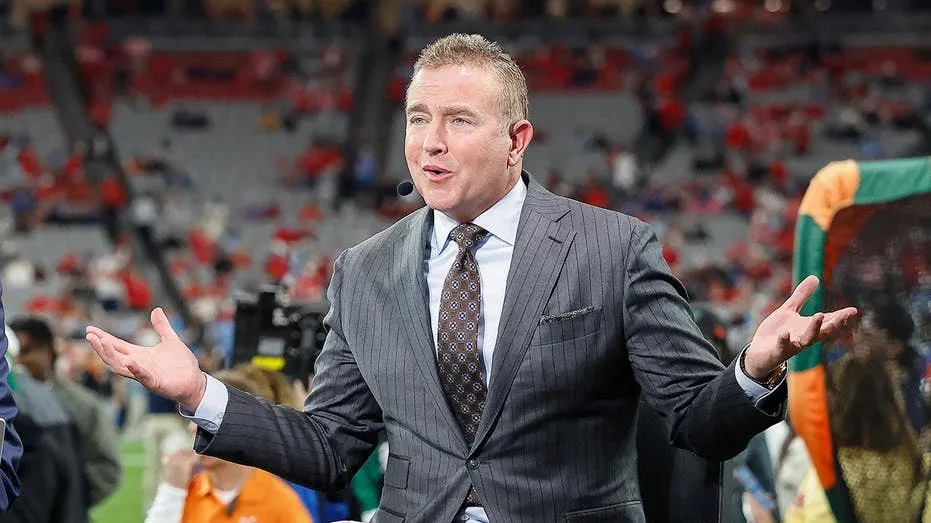 Kirk Herbstreit and his former gymnast wife have four boys thanks to handstands on the bed