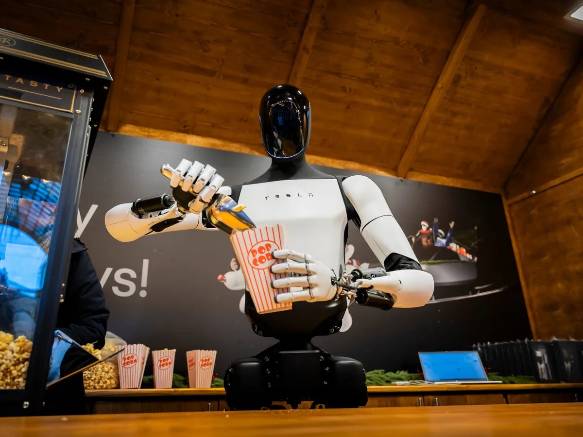 Elon Musk wrangles with the robot hand