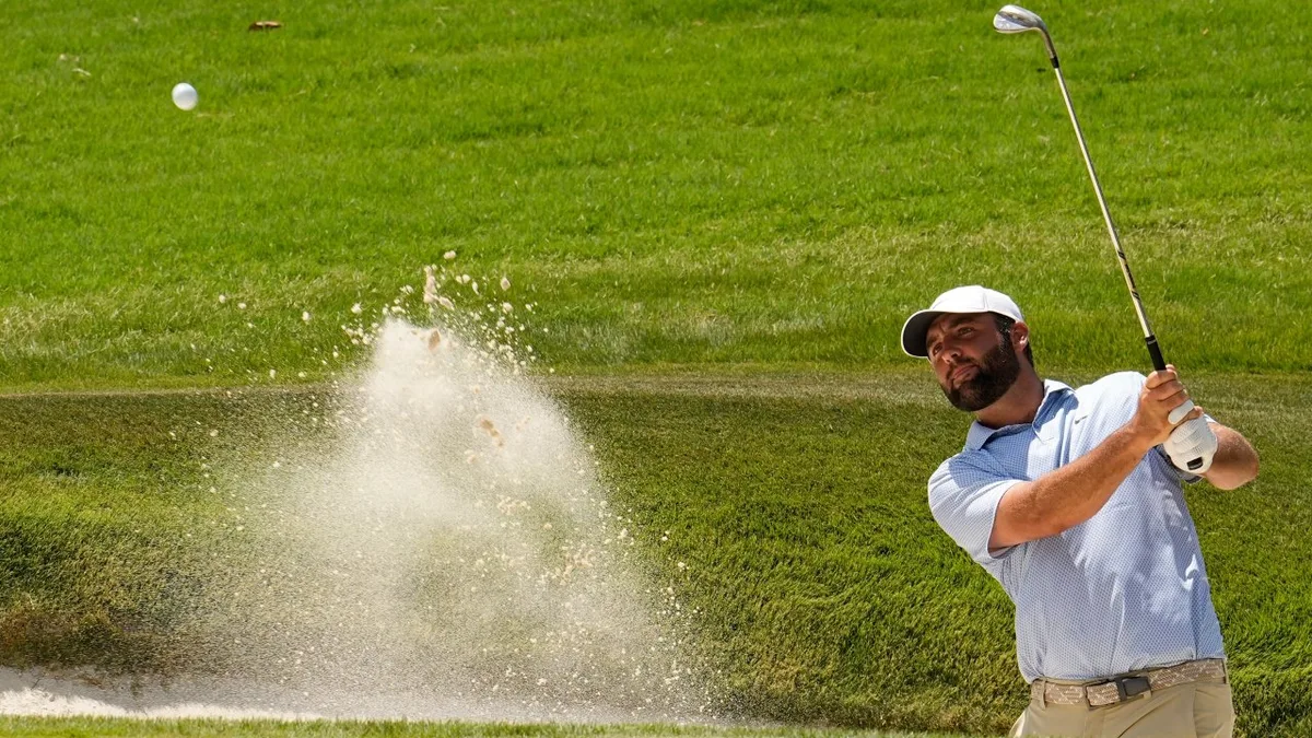 Bounce off sprinkler head sends Scheffler’s shot into water for bogey