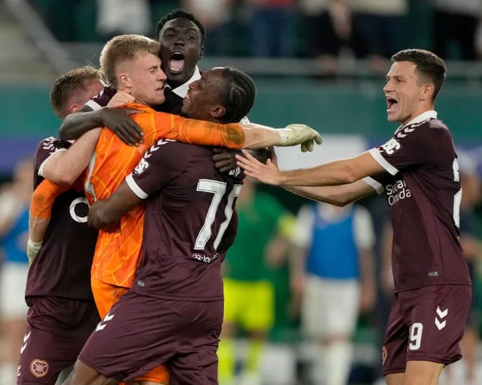 Ten-man Hearts stun Rapid Vienna in shootout to reach Conference League