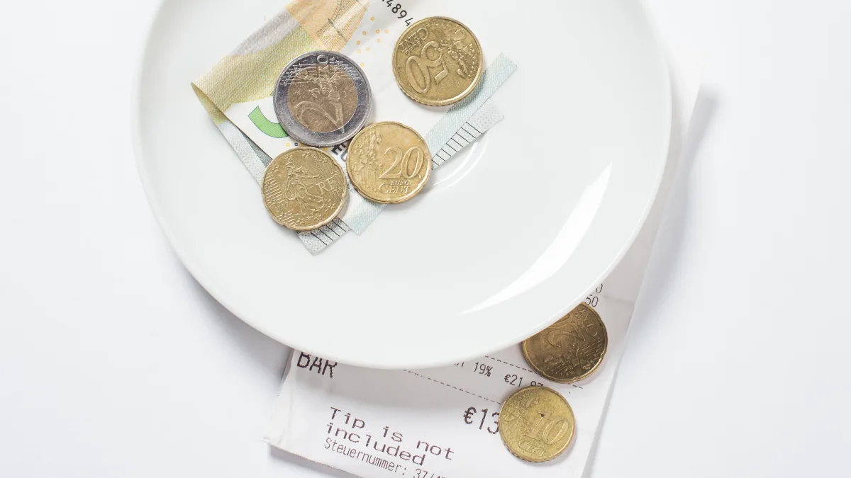 Ein Balance-Akt: Verlangt bald auch der Zahnarzt Trinkgeld?