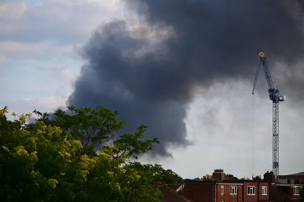 Mitcham fire live: Huge plumes of smoke fill London sky as 125 firefighters tackle grass blaze