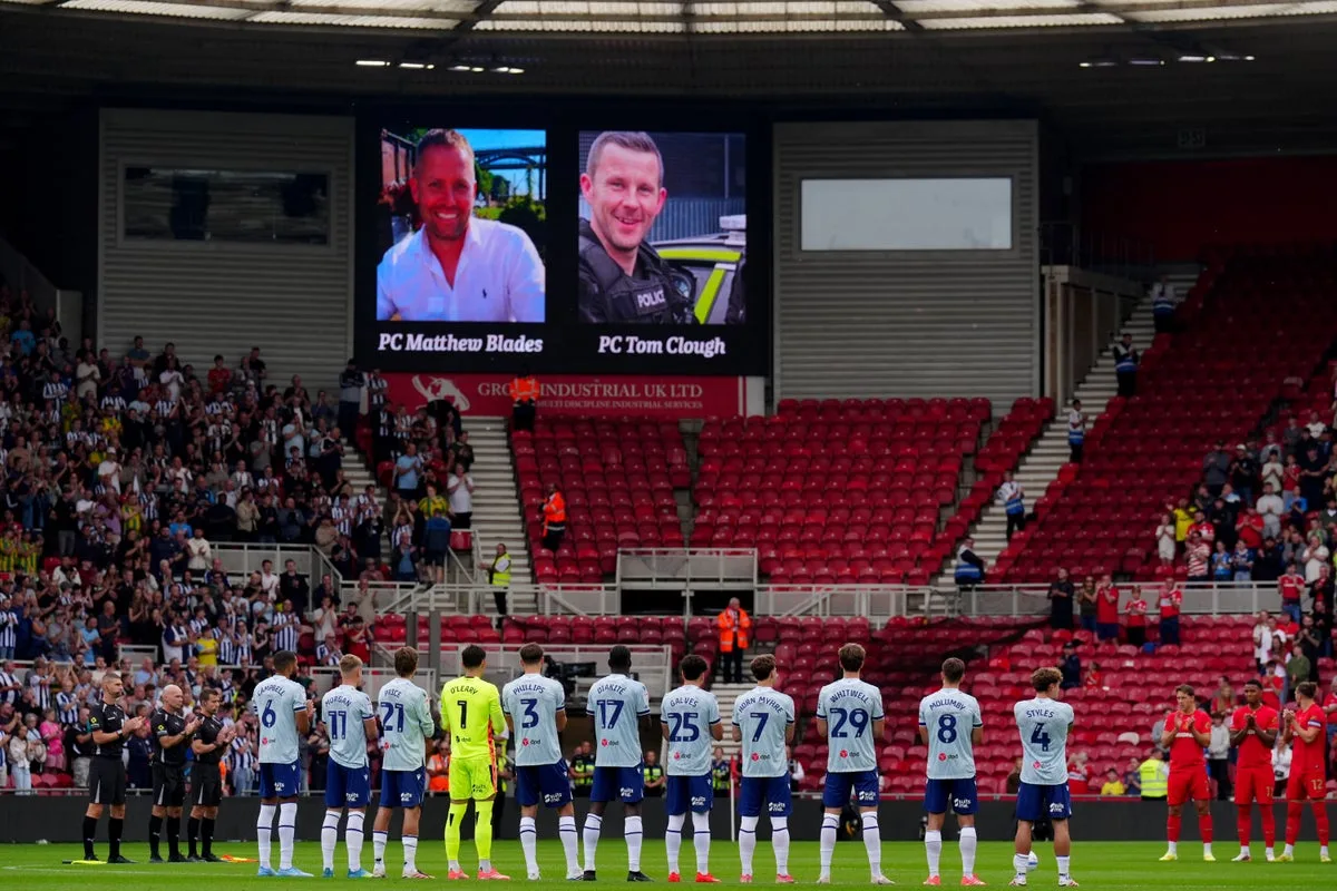 Football fans pay moving tribute to two officers killed in A66 crash