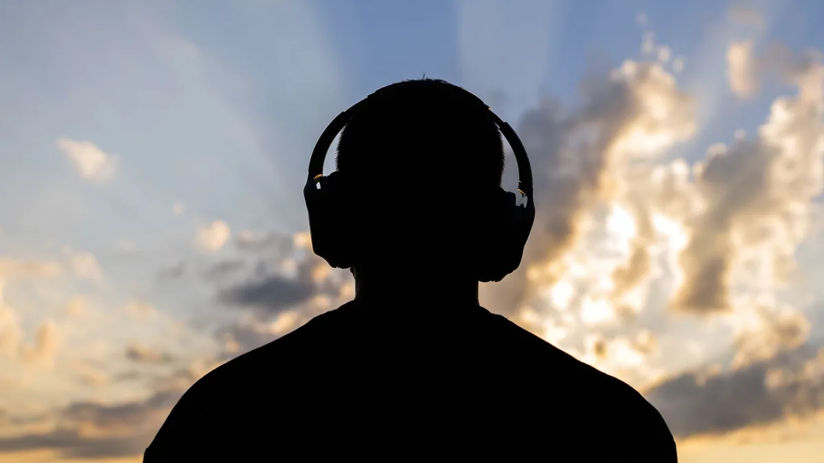 Researchers can make headphones leak audio through a wall, but the 30-meter claim has a few caveats