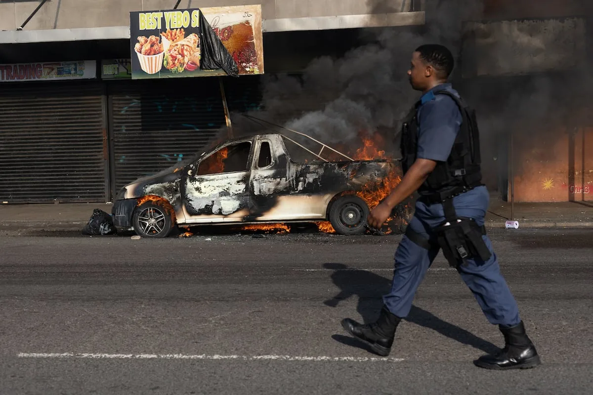 WATCH | Burnt cars stripped as calm returns to Durban CBD