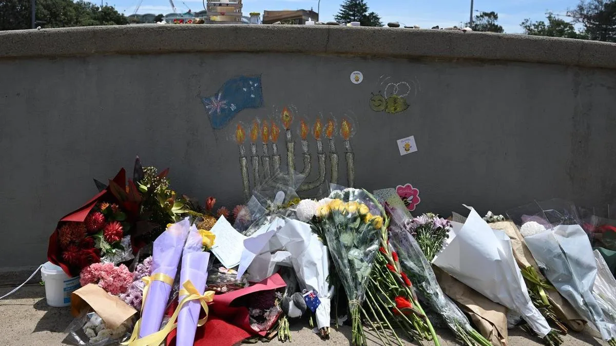 Man charged over 'offensive' act at Bondi attack site