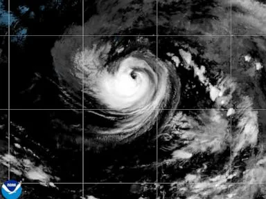 Tropical Storm Karina strengthens into a hurricane in the Pacific