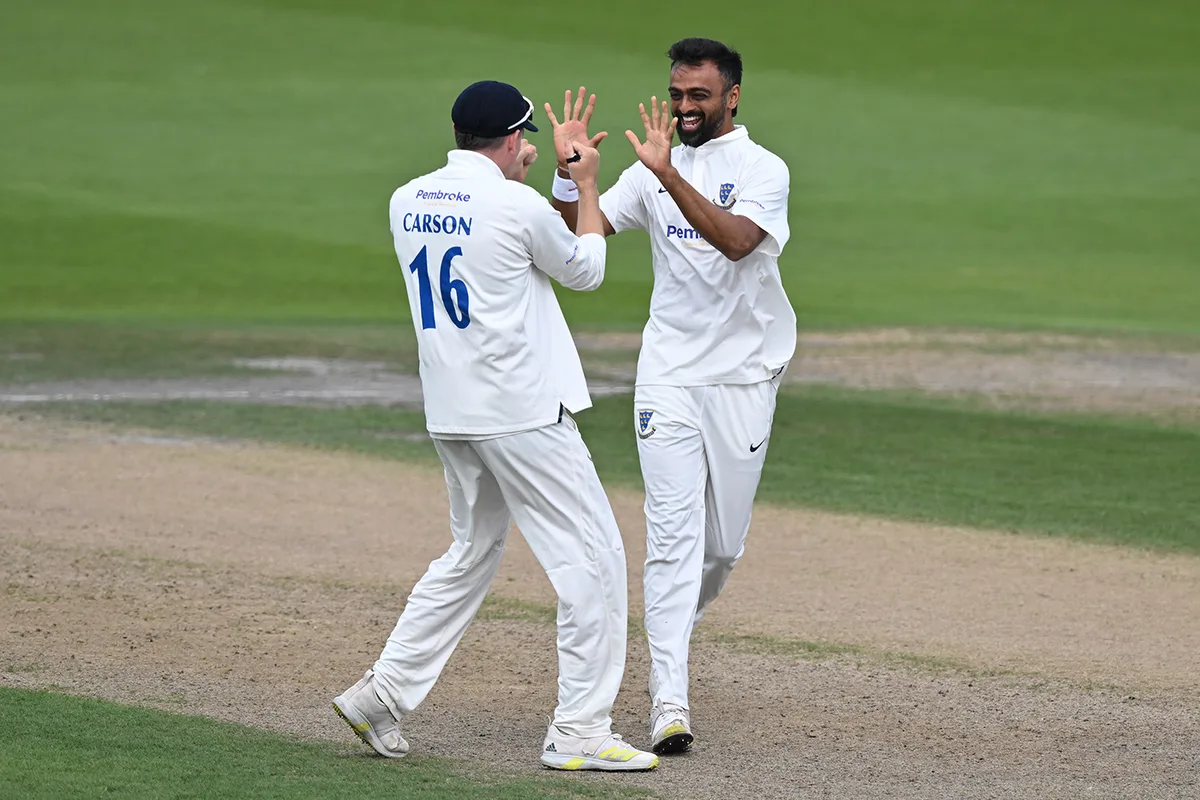 Hutton grit helps bail out champions at Hove
