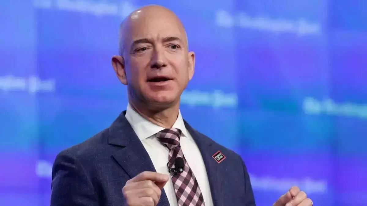 Jeff Bezos makes sports debut with consortium taking nearly 40% of Liverpool